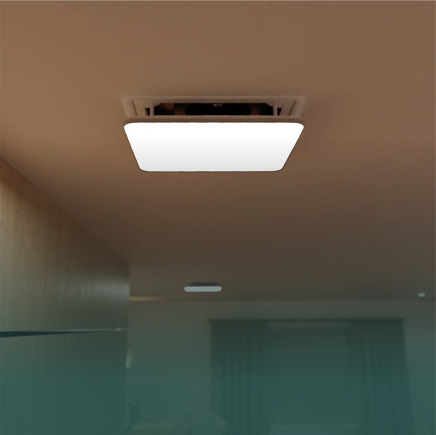Modern ceiling light fixture illuminating a minimalist room with soft ambient lighting
